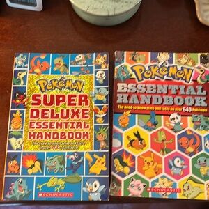 Books set of 2. Pokémon Super Deluxe Essential Handbook and Essential Handbook